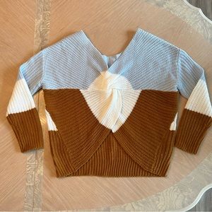 Blue, white, brown v-neck v-opening at waist sweater.